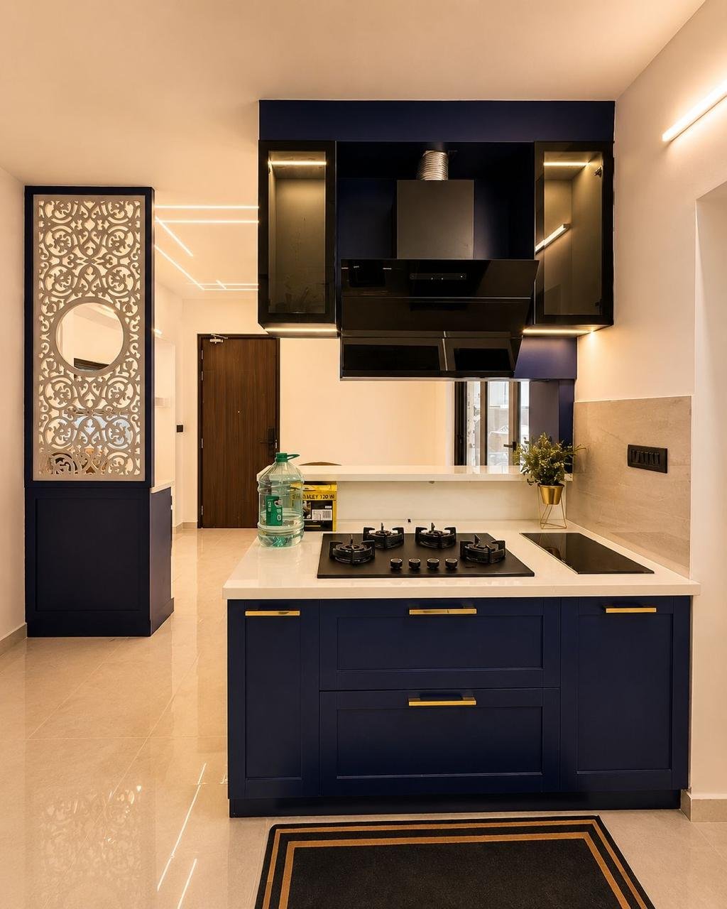 Elegant kitchen with navy cabinets and gold hardware in Chennai